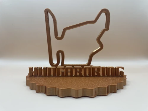 Sculpture décorative imprimée en 3D représentant le tracé du circuit de Hungaroring sur un socle cranté stylisé, finition métallique.