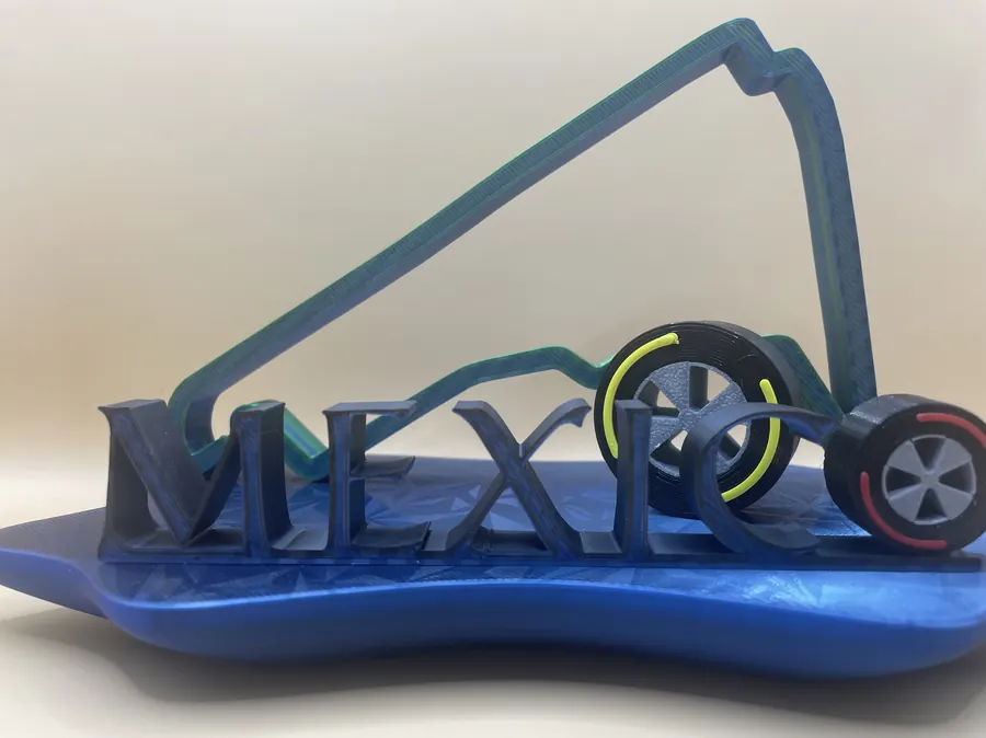 Décoration imprimée en 3D représentant le tracé du circuit de Mexico avec deux pneus stylisés et un socle design.