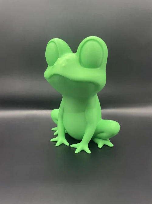 Figurine grenouille design imprimée en 3D, style low-poly, en vert.