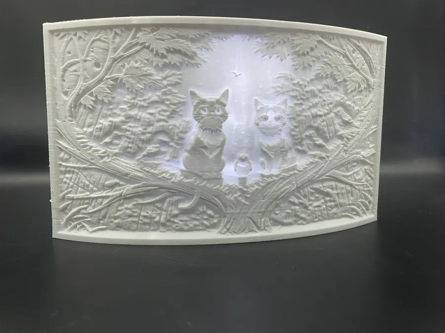 Lampe décorative en lithophanie représentant des chats dans une forêt sous la pluie, style artistique en 3D.