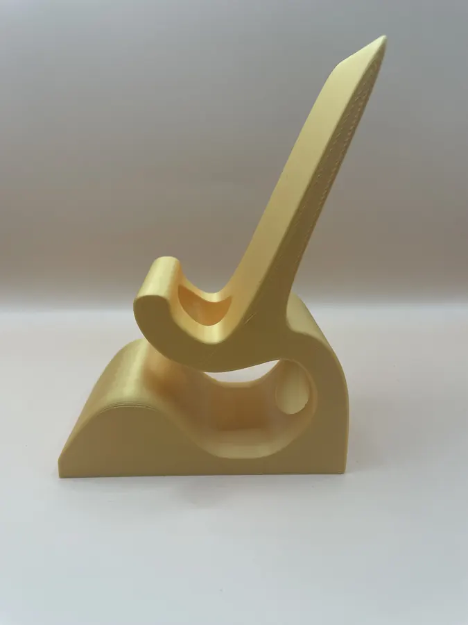 Support de téléphone 3D imprimé, version noire et version dorée, finition moderne.